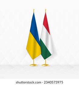 Ukraine and Hungary flags on flag stand, illustration for diplomacy and other meeting between Ukraine and Hungary. Vector illustration.