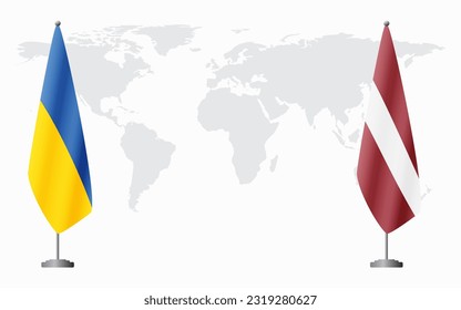 Ukraine and Latvia flags for official meeting against background of world map.