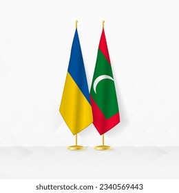 Ukraine and Maldives flags on flag stand, illustration for diplomacy and other meeting between Ukraine and Maldives. Vector illustration.