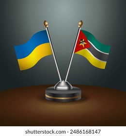 Ukraine and Mozambique flag together. Small table flag with color gradient background
