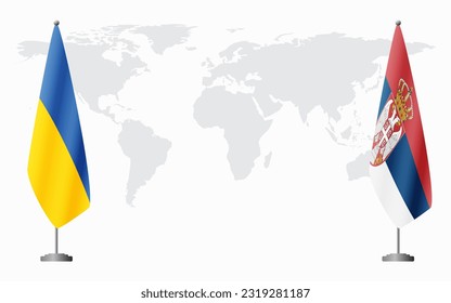 Ukraine and Serbia flags for official meeting against background of world map.