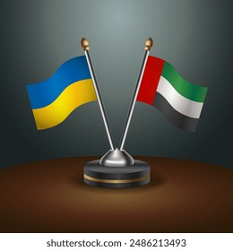 Ukraine and United Arab Emirates flag together. Small table flag with color gradient background
