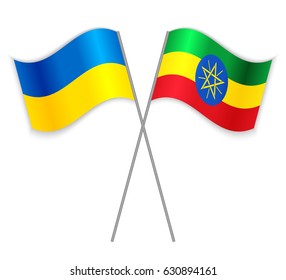 Ukrainian and Ethiopian crossed flags. Ukraine combined with Ethiopia isolated on white. Language learning, international business or travel concept.