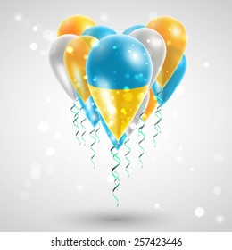 Ukrainian flag on air balls in heart-shaped. Celebration and gifts. Ribbon in the colors are twisted under the balloon. Independence Day. Balloons on feast of the national