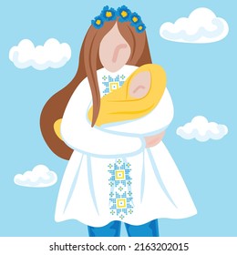 Ukrainian mother in national clothes with child clouds on the background