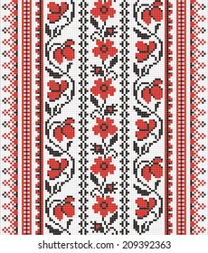 Ukrainian ornament with red and black elements on the white background