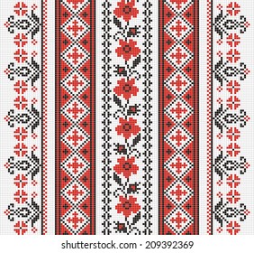 Ukrainian ornament with red and black elements on the white background