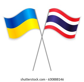 Ukrainian and Thai crossed flags. Ukraine combined with Thailand isolated on white. Language learning, international business or travel concept.