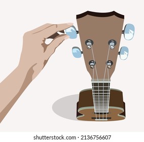 Ukulele from high point of view with a hand trying to tune it, isolated on bright background