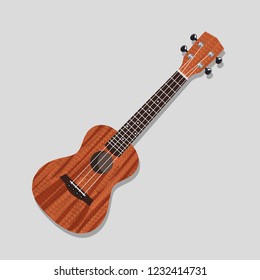 ukulele on a light background. guitar from Hawaiian. Four strings. Wooden guitar.