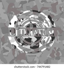 Ultimatum on grey camouflaged texture