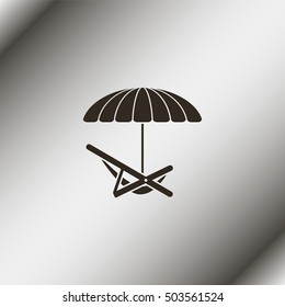 Umbrella with deck chair.