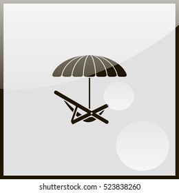 Umbrella with deck chair.
