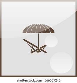 Umbrella with deck chair.