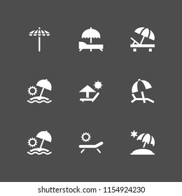 umbrella icon. 9 umbrella set with sun umbrella, parasol and deck chair under summer sun and sunbed vector icons for web and mobile app