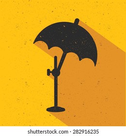 Umbrella icon design on yellow background, flat design. Clean vector.