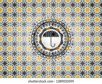 umbrella icon inside arabesque style emblem. arabic decoration.