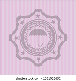 umbrella icon inside badge with pink background