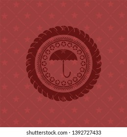umbrella icon inside badge with red background