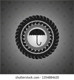 umbrella icon inside black badge
