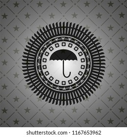 umbrella icon inside black emblem