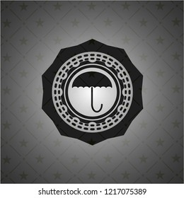 umbrella icon inside black emblem