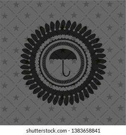 umbrella icon inside black emblem