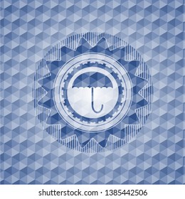 umbrella icon inside blue badge with geometric pattern.