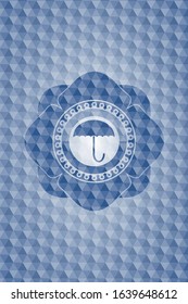 umbrella icon inside blue emblem with geometric pattern.