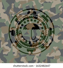 umbrella icon inside camouflaged emblem