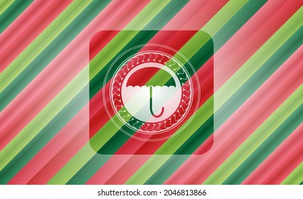 umbrella icon inside christmas badge. 