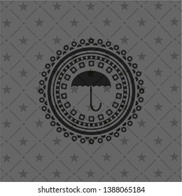 umbrella icon inside dark emblem