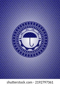 umbrella icon inside denim background. 