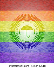 umbrella icon inside emblem on mosaic background with the colors of the LGBT flag
