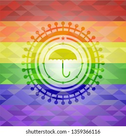 umbrella icon inside emblem on mosaic background with the colors of the LGBT flag