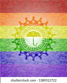 umbrella icon inside emblem on mosaic background with the colors of the LGBT flag