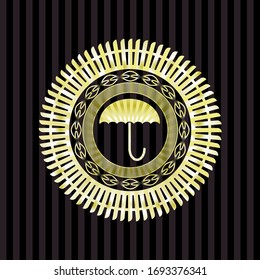 umbrella icon inside gold emblem or badge