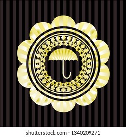 umbrella icon inside golden emblem