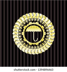 umbrella icon inside golden emblem or badge