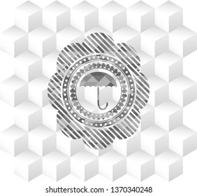 umbrella icon inside grey emblem. Vintage with geometric cube white background