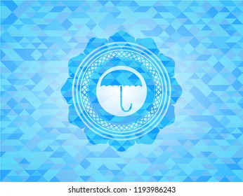umbrella icon inside light blue emblem with mosaic background