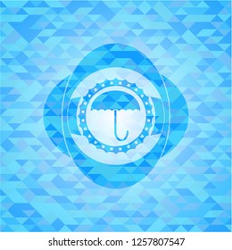 umbrella icon inside light blue emblem. Mosaic background
