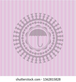 umbrella icon inside pink emblem. Vintage.