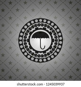 umbrella icon inside realistic black emblem