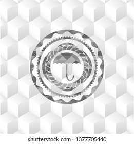 umbrella icon inside realistic grey emblem with cube white background