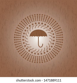 umbrella icon inside realistic wood emblem