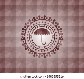 umbrella icon inside red emblem with geometric pattern background.