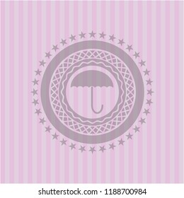 umbrella icon inside retro pink emblem