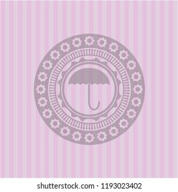 umbrella icon inside retro pink emblem