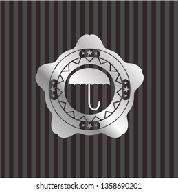 umbrella icon inside silver shiny badge